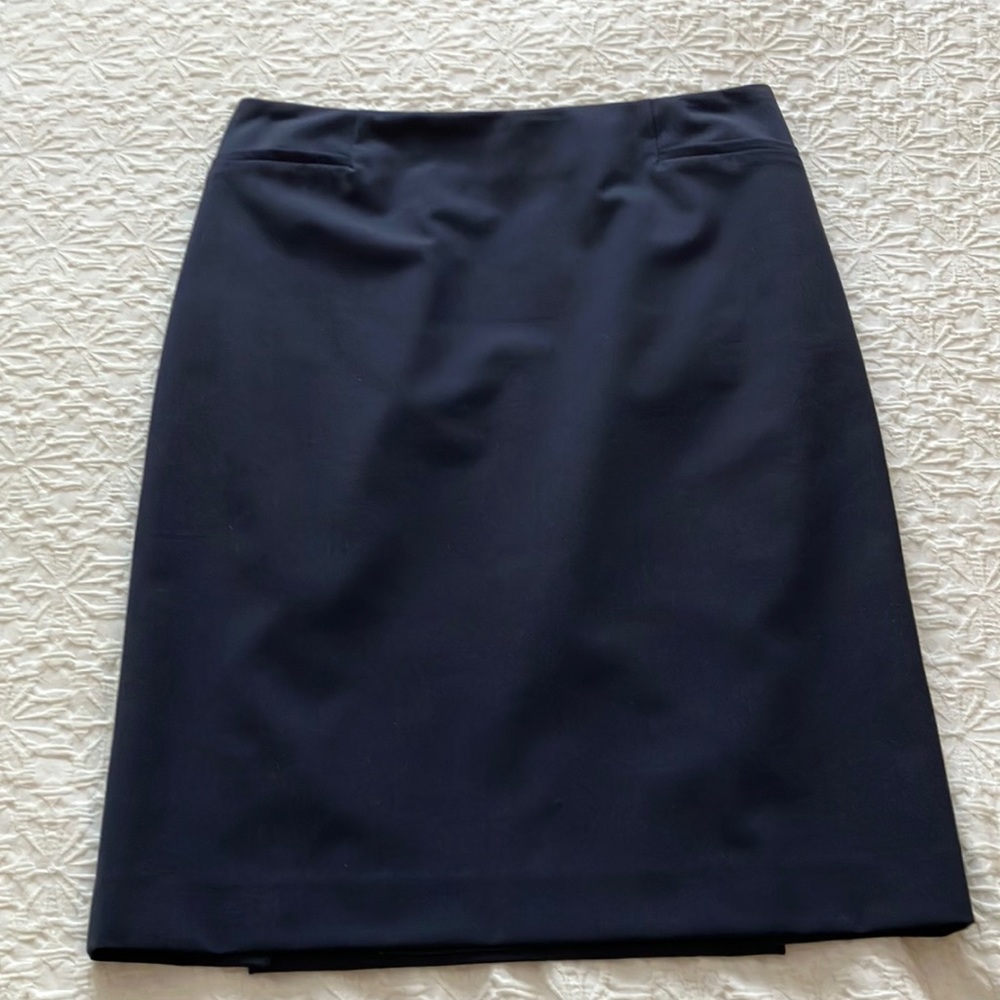 Classic navy Teenflo fully lined skirt with back invisible zip and kick panel